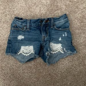 Girl’s distressed/crochet jean shorts
